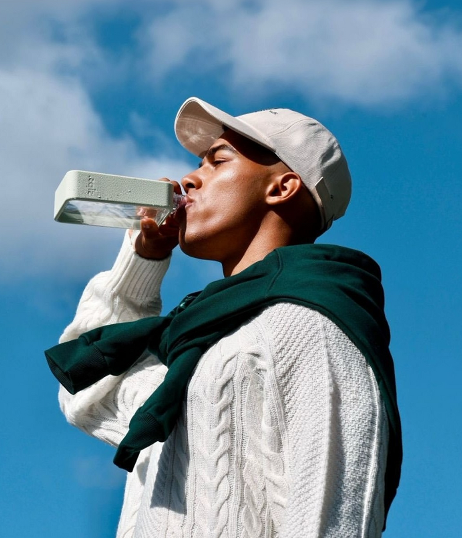 Commuter using slim water bottle